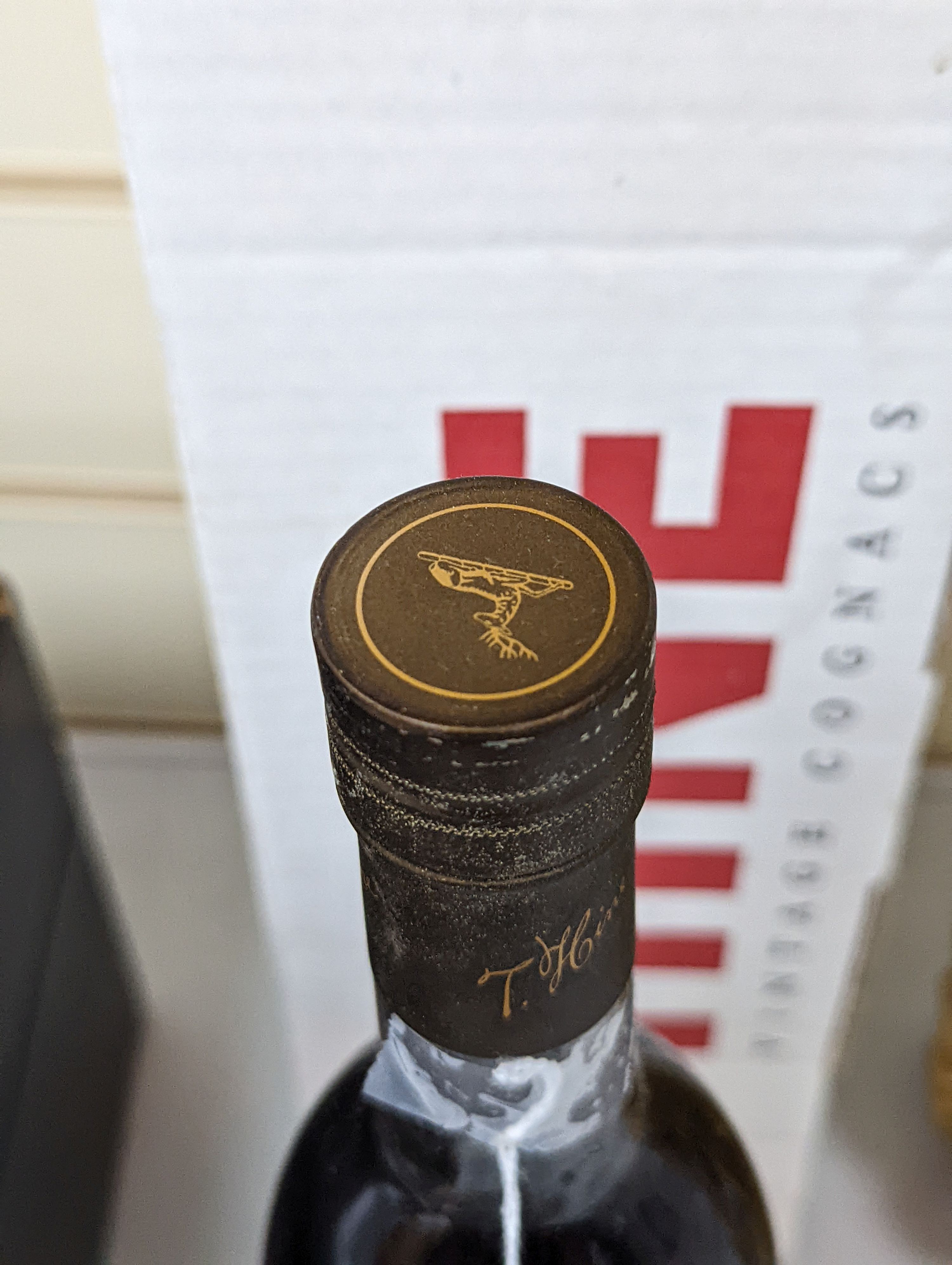 One bottle of Hine Grand Champagne Cognac, 1975. Original cardboard box.